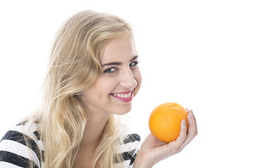 Model Released. Attractive Young Woman Holding a Whole Orange