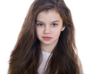 Fototapeta premium Portrait of a charming little girl smiling at camera