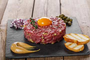 Beef tartare with capers yolk and mustard