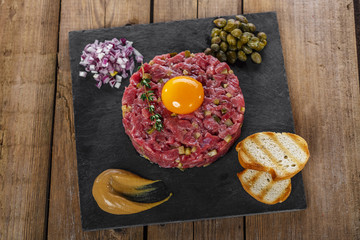 Beef tartare with capers yolk and mustard