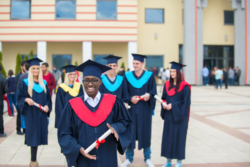 group of graduates celebrating outdoors