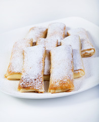 Delicious pancakes with powdered sugar.