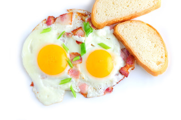 Two fried eggs and bacon