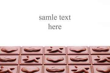 Chocolate on white background with space for text