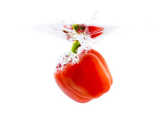 red bell pepper dropping in water
