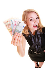 Economy finance. Woman holds euro currency money.