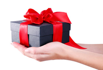 Woman's hands holding gift box isolated on white