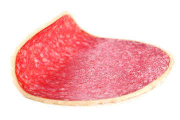 Slice of salami isolated on white background