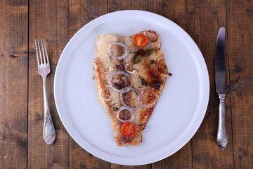 Dish of Pangasius fillet with spices and vegetables