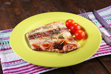 Dish of Pangasius fillet with rosemary and cherry tomatoes in