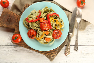 Tasty pasta with pepper, carrot and tomatoes