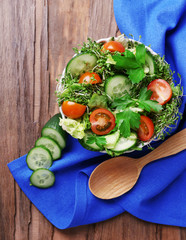 Cress salad with sliced cucumber, cherry tomatoes and parsley