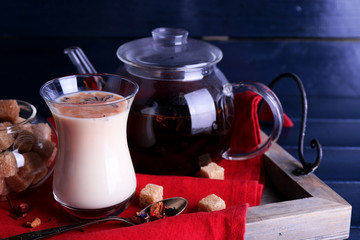 Black tea with milk and lump sugar