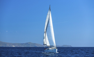 Sailing ship yachts with white sails. Luxery sailing yacht.