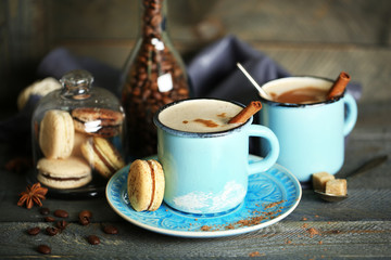 Beautiful composition with tasty cappuccino on wooden table