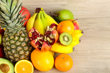 Assortment of exotic fruits on wooden background