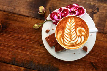 cup of cappuccino on a wooden table