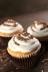 Delicious cupcakes on table close-up