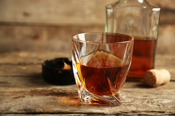 Whiskey on wooden background