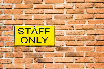 Fototapeta na wymiar Staff only notice on wall