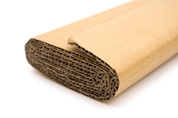 piece of folded cardboard corrugated on a white background