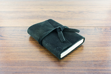 Leather notebooks on wood