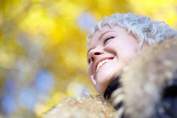 Smiling blond looks into the distance