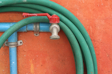 One faucet with green hose