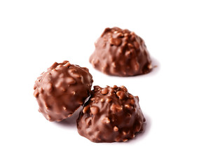 chocolate candy with nuts close-up on white background
