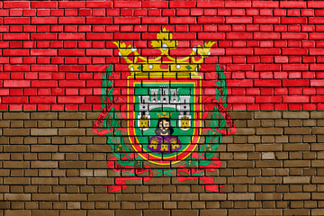 flag of Burgos painted on brick wall