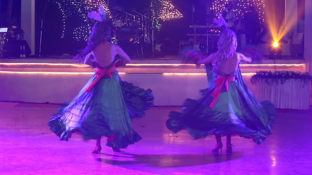 two girls in cabaret costumes dance cancan	