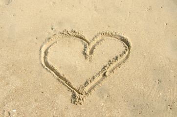 Fototapeta na wymiar Beach background with hearts drawing