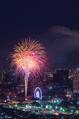 Bangkok cityscape and village view with fireworks night scene 