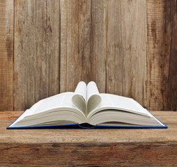 book heart shape page open wooden wall table background