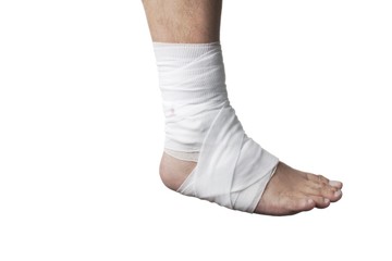 human leg wrapped with white bandage