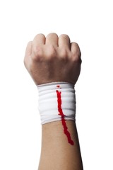 bandage on a human hand with blood on it