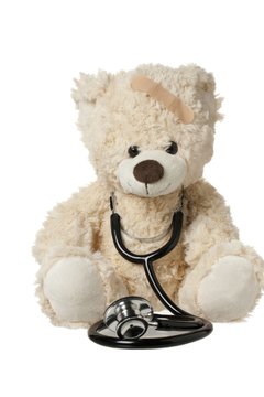 cute teddy bear with a bandage and stethoscope