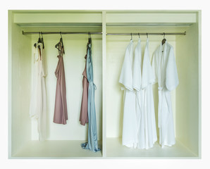 dressing gown hanging in a white wardrobe