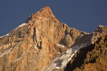 high mountain rocks at sunset