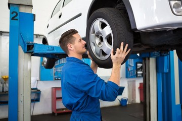 Mechanic adjusting the tire wheel