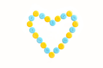blue and yellow heart from plastic clasper