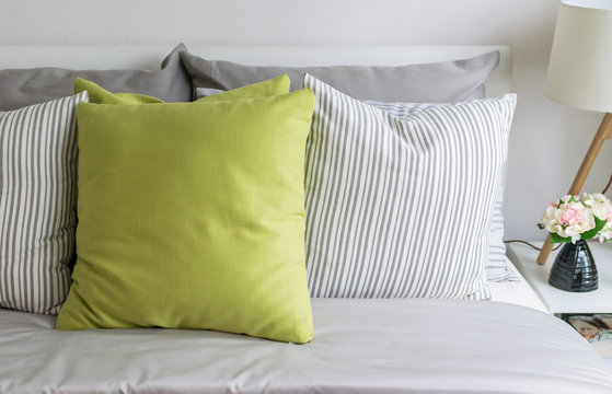 Modern Bedroom With Green Pillow On Bed