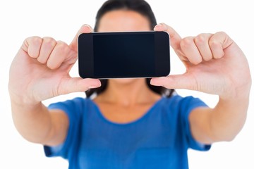 Pretty brunette taking a selfie