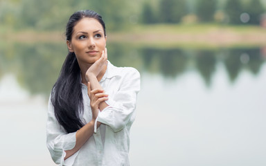 Beautiful spring young woman in the nature