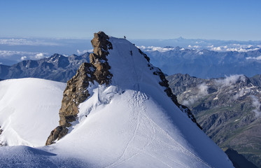 Fototapeta na wymiar Climbers on Corno Nero peak, Monte Rosa, Alps, Italy