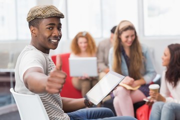 Fototapeta premium Fashion student using tablet pc