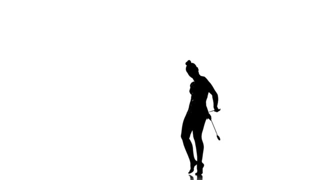 Silhouettes Pretty young woman doing exercises with Juggling