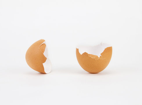broken and cracked egg shell on white background