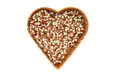 beans in heart form basket isolated on white