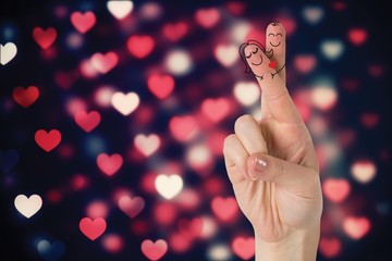 Composite image of fingers crossed like a couple